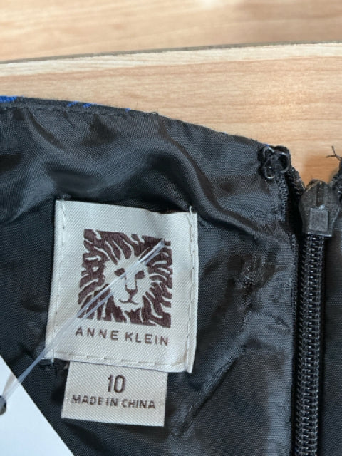Anne Klein brand tag with lion logo and size 10 label sewn into the black lining of the pre-owned floral jacquard dress made in China.