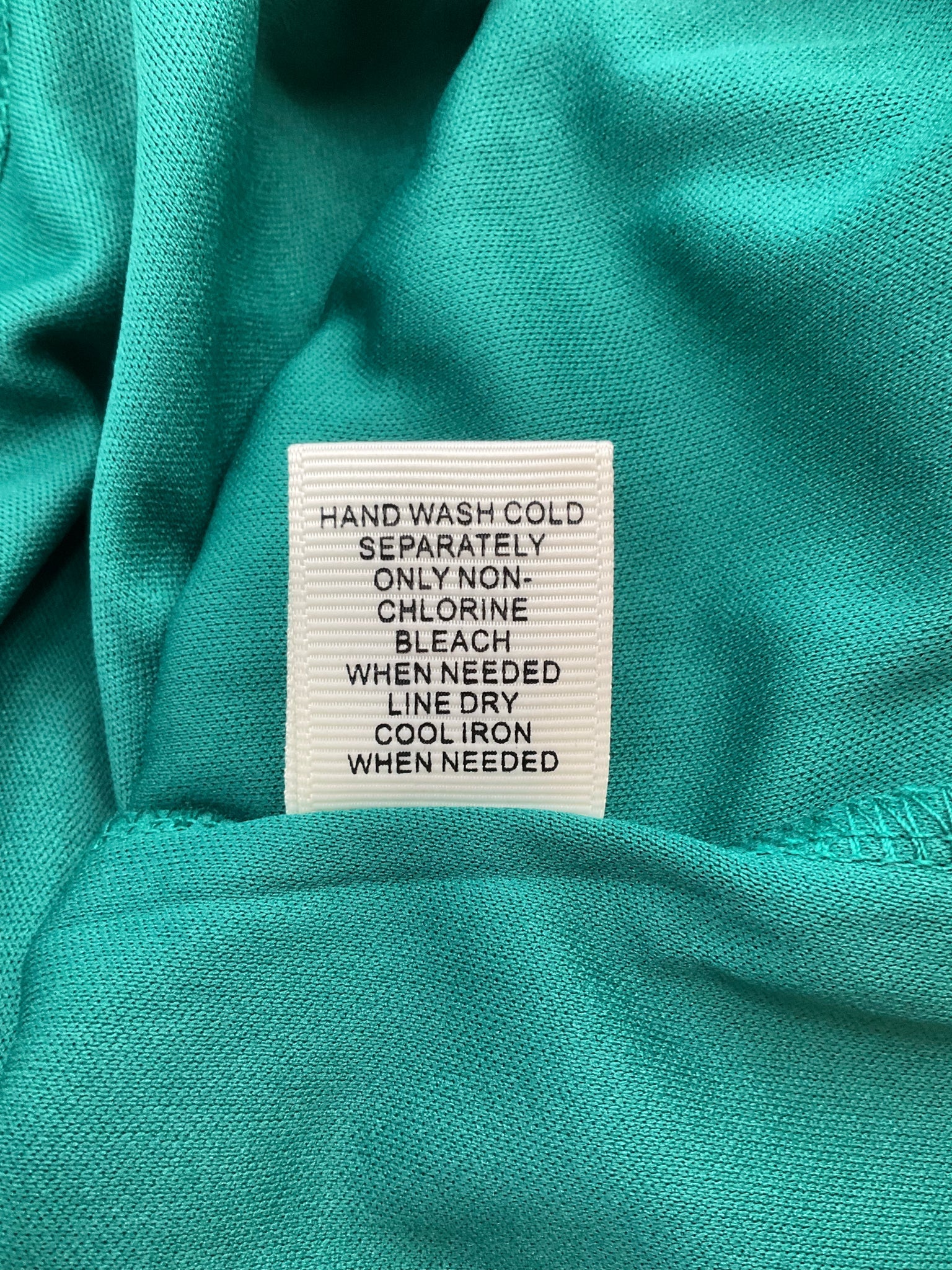 Ultra Pink boho ladies tunic top in pink and green lace, featuring bell sleeves, size medium.