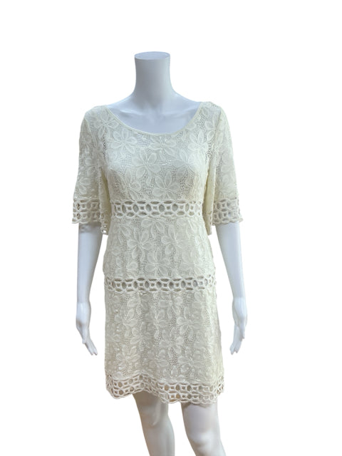 Front view of Laundry Cream Lace Pre-Owned Ladies Dress - Size 4 on mannequin, showcasing floral lace pattern and knee-length sheath cut.