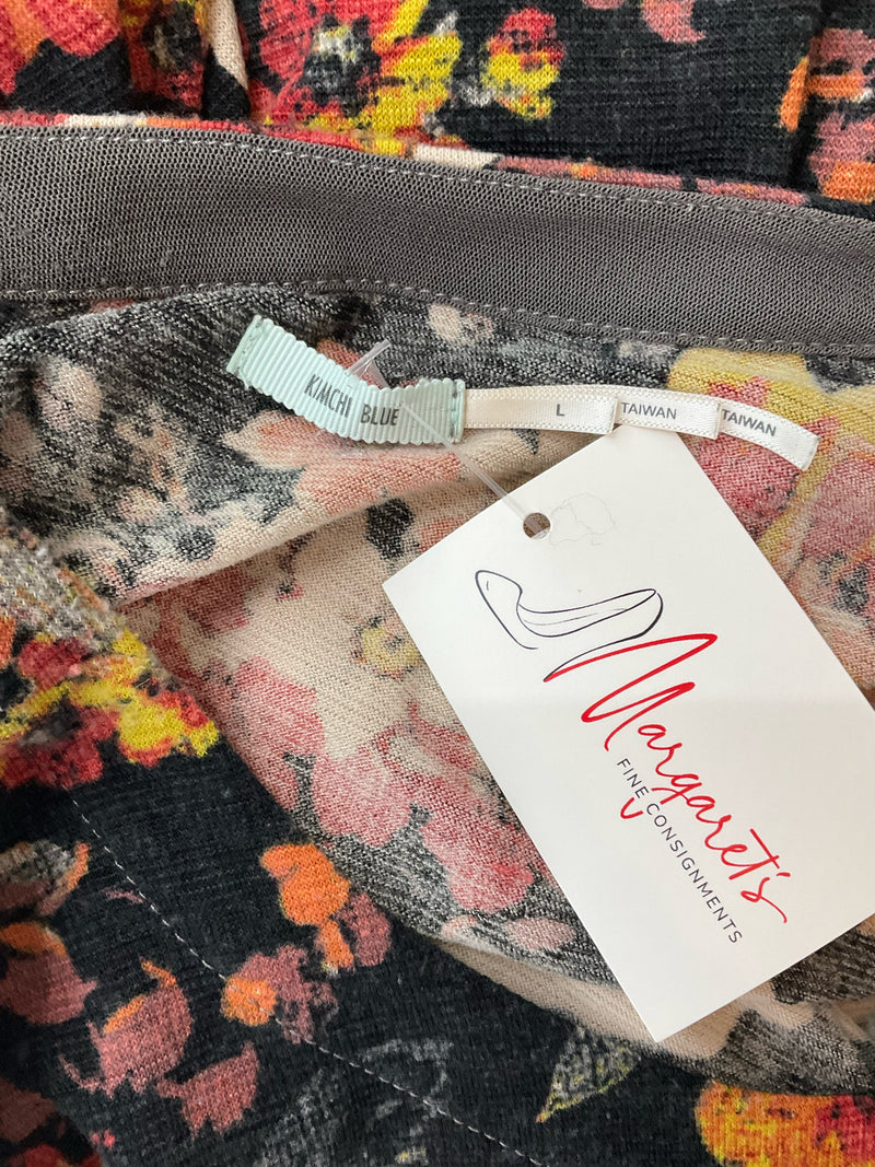 Close-up of Kimchi Blue label and consignment tag on Black/Cream/Red Floral Pre-Owned Ladies Dress - Size Large, made in Taiwan.