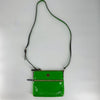 Kate Spade Lime Green Solid Pre-Owned Crossbody Bag with patent leather finish, gold-tone zipper, and adjustable strap, available at Margaret's.
