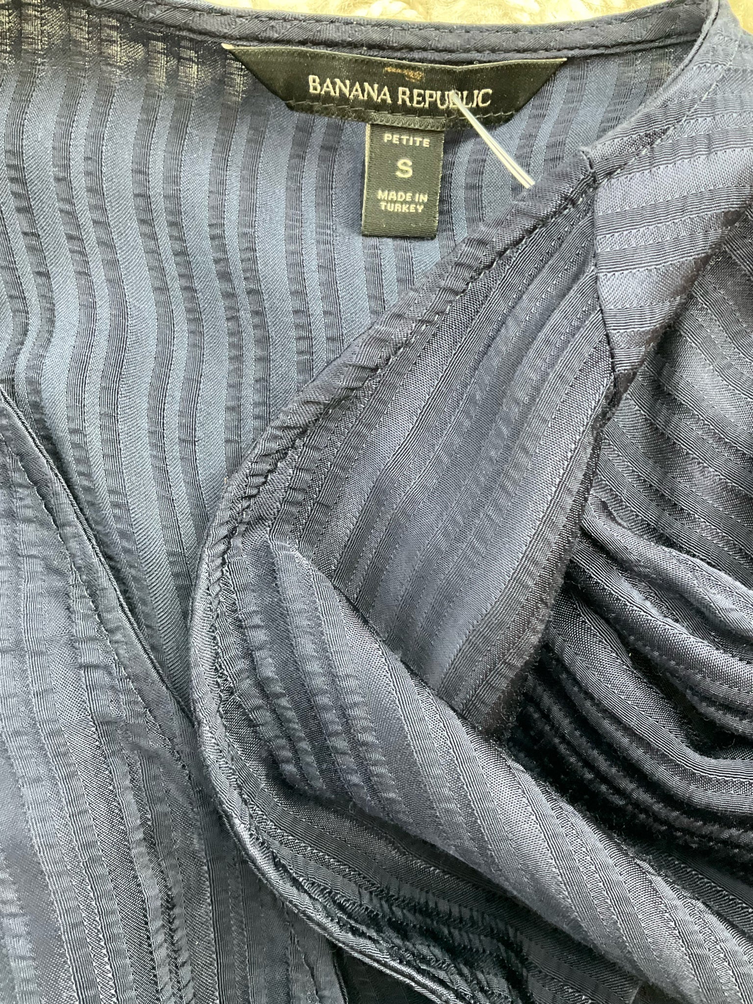 Navy ribbed long sleeve crewneck top by Banana Republic, fitted style in size small petite.