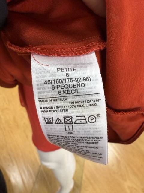 Close-up of the Banana Republic Sleeveless Mini Dress Size 6P label, showing petite sizing and 100% silk material details.