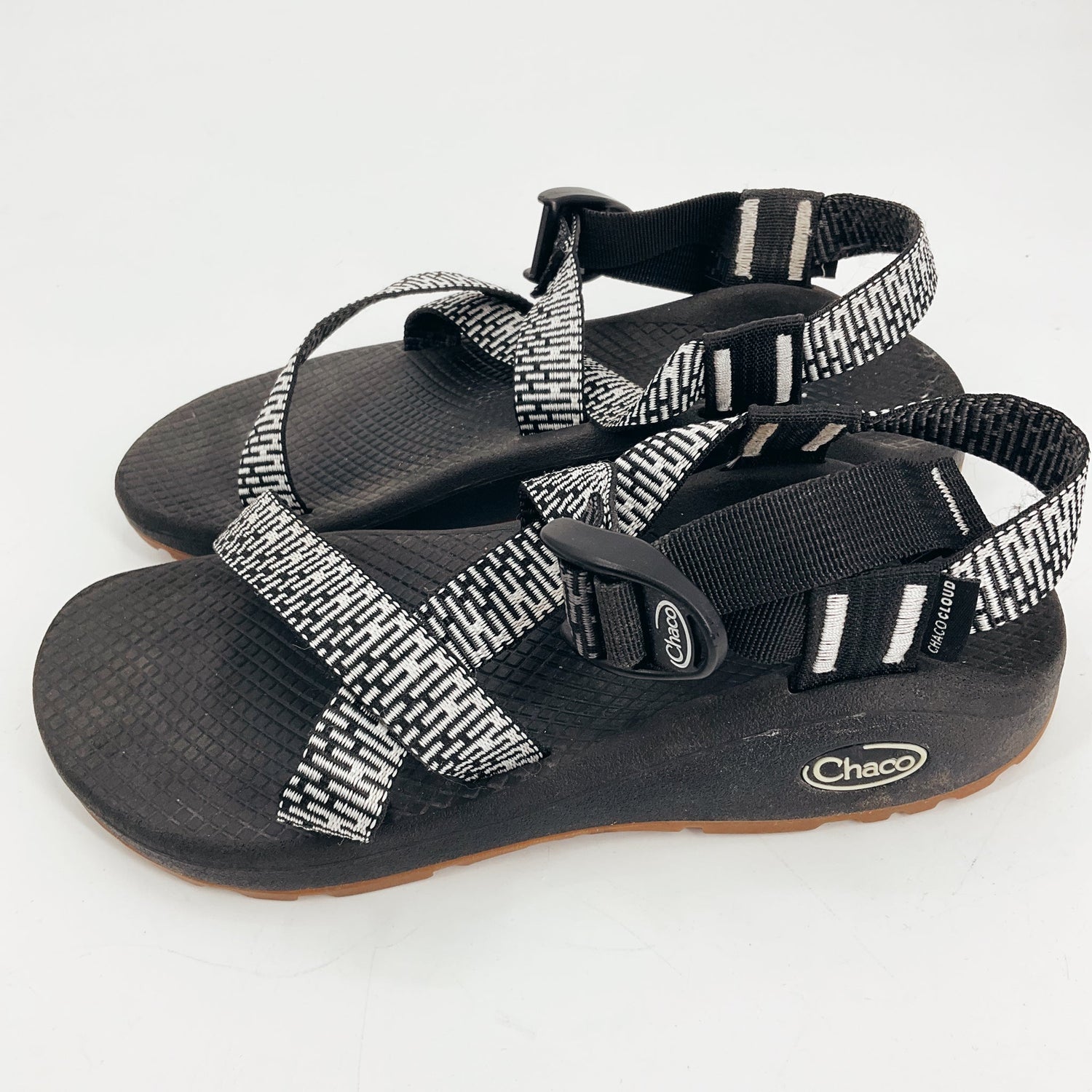 Chaco Black/White Print Pre-Owned Ladies Sandals - Size 6 featuring Cubic Black straps, toe-loop, and adjustable buckles for outdoor comfort.