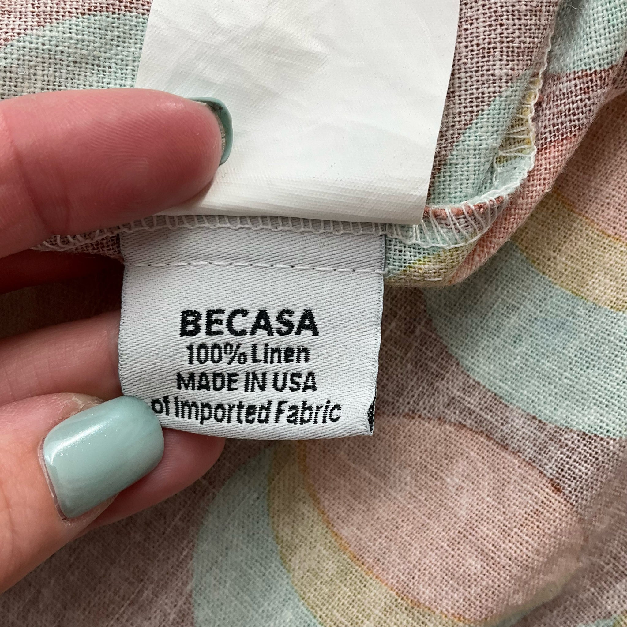 Fabric tag showing Becasa dress is 100% linen, made in USA of imported fabric. Rust/Multi Circles Print Dress - Size XS, pre-owned at Margaret’s.