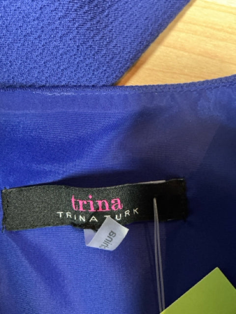 Brand label of Trina Turk Blue Solid Pre-Owned Ladies Dress Size 8 with medium size tag and original tag attached.