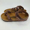 Birkenstock Sandals Size 6 in brown leather with adjustable ankle and toe straps, gently used and available at Margaret’s Fine Consignments.