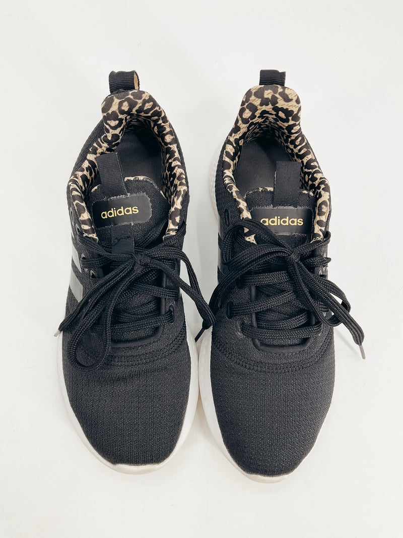 Top view of Adidas Black Solid Pre-Owned Ladies Sneakers - Size 7 featuring leopard print inner lining and black laces.