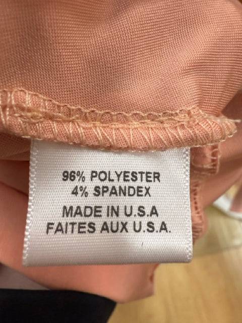 Fabric content label indicating 96% polyester and 4% spandex for the MISA Mini Dress Size Medium, made in the USA, at Margaret’s Fine Consignments.