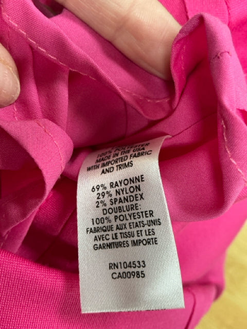 Close-up of fabric tag on Nanette Lepore Fuchsia Pink Dress Size 8, showing rayon, nylon, and spandex blend for comfort and stretch.