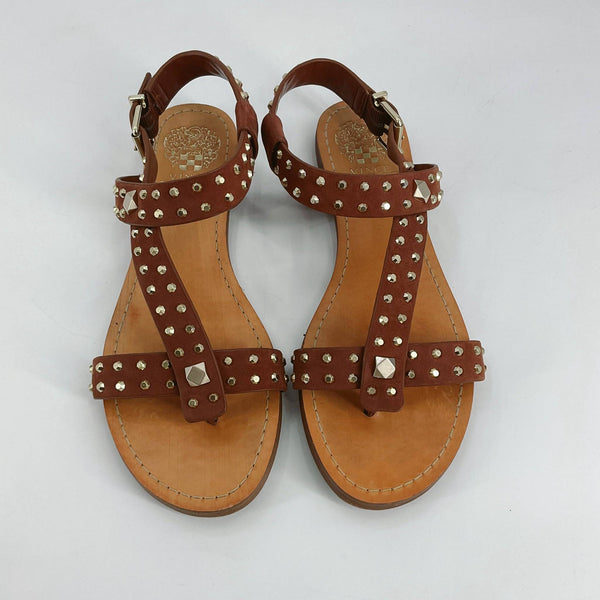 Top view of Vince Camuto camel studded sandals size 7.5, showcasing T-strap design and cushioned sole, sold by Margaret’s Fine Consignments.