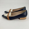 Cole Haan Flats Size 8 in navy and cream with tan buckle detail, low wooden heel, available at Margaret’s Fine Consignments.