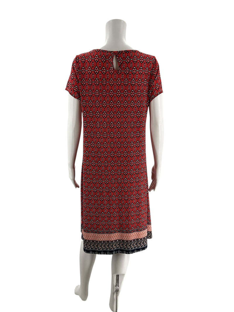 Back view of Western Connection orange navy geometric print midi dress with keyhole neckline and short sleeves, perfect for vacation or casual outings.