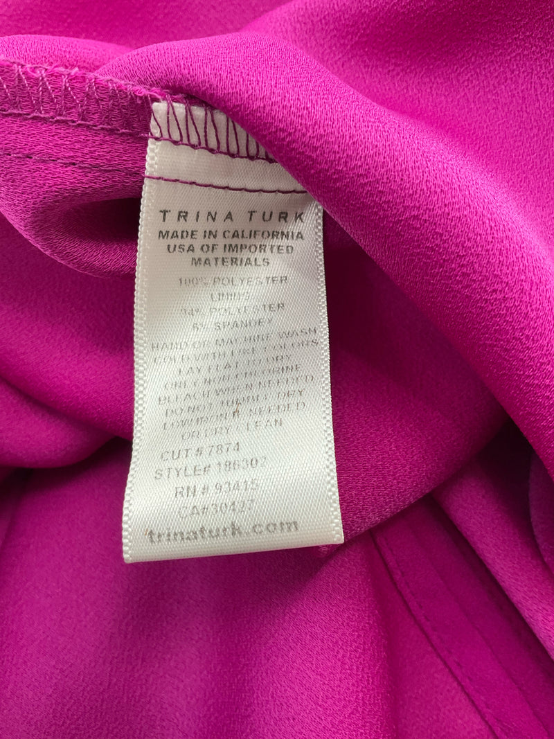 Fabric care label of Trina Turk Fuschia Solid Pre-Owned Ladies Dress Size 10 showing 100% polyester material and Made in USA origin.