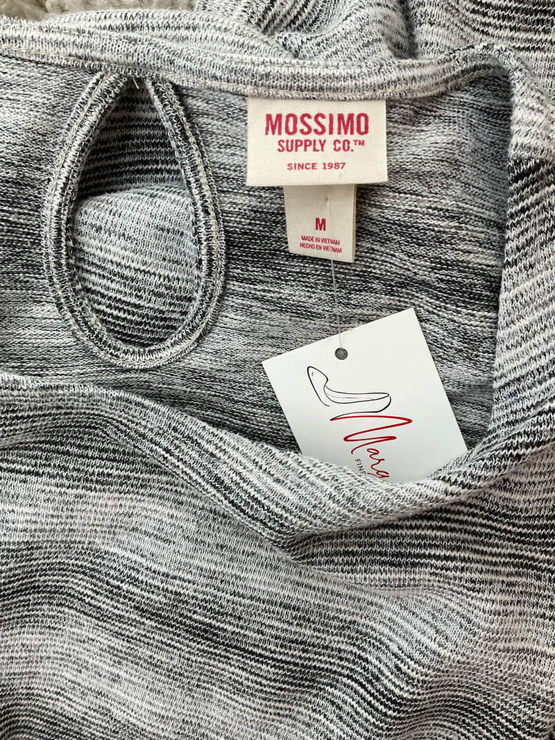 Close-up of Mossimo Supply Co. dress label showing brand tag, size medium, and keyhole back detail on gray space dye knit fabric.