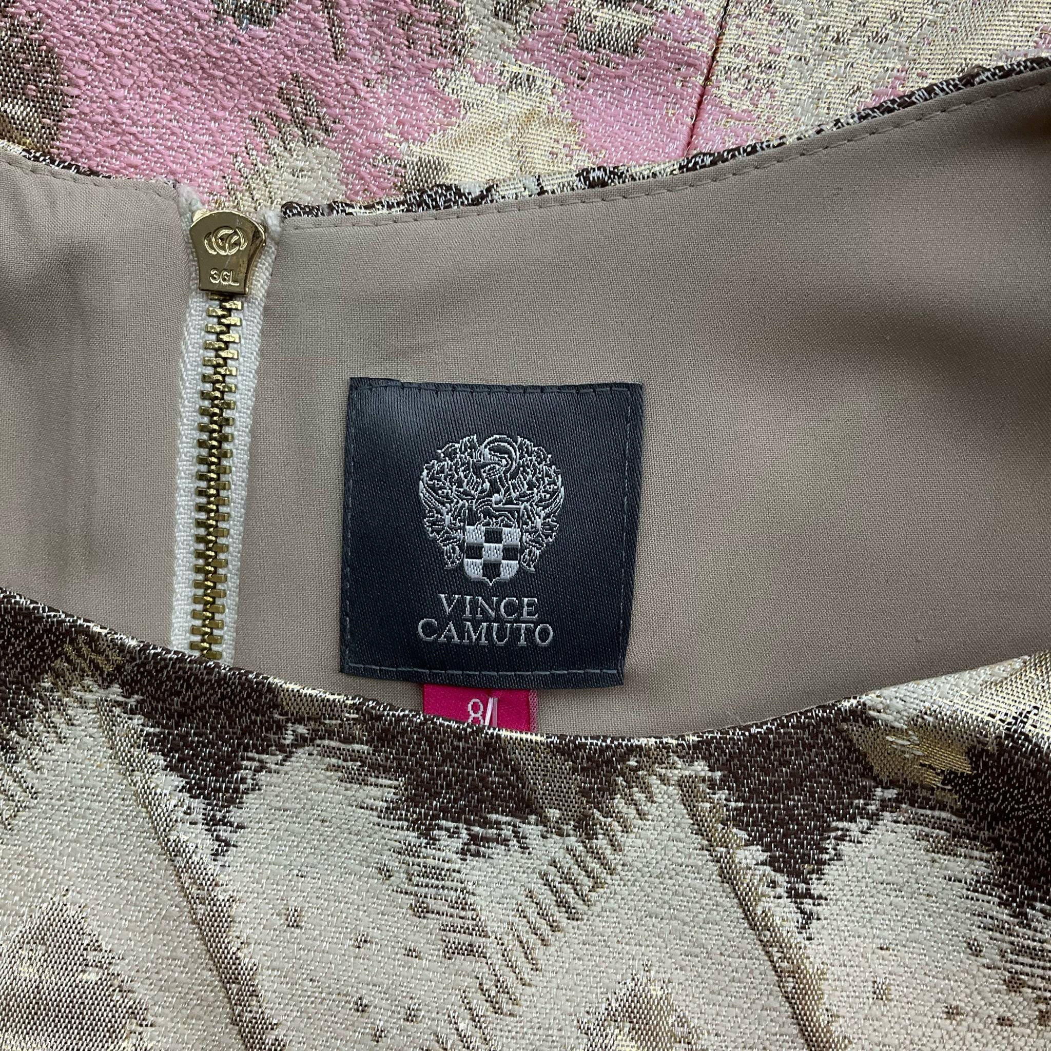 Close-up of Vince Camuto brand label on the Sparkle Mini Dress, showcasing the neckline and zipper detail.