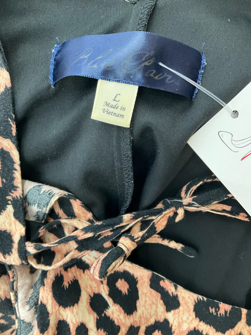 Close-up of Blue Rain dress label showing size large and brand tag, confirming authenticity of pre-owned item.