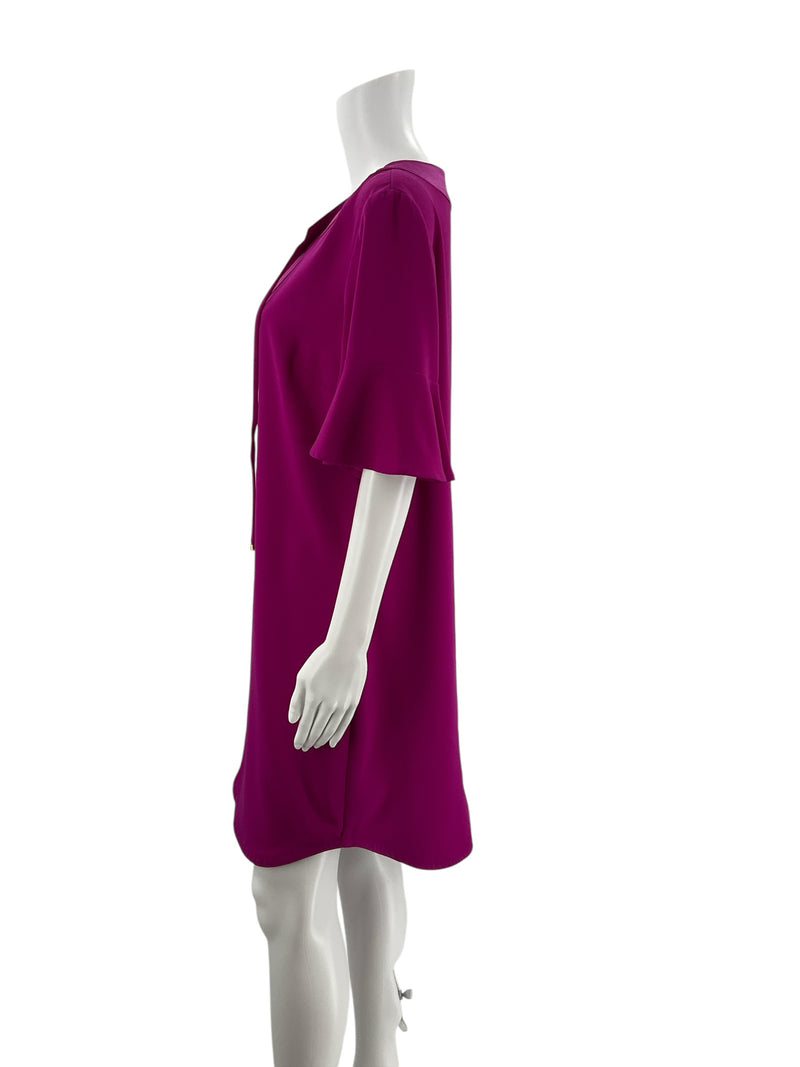 Side profile of Trina Turk Fuschia Solid Pre-Owned Ladies Dress Size 10 highlighting the flowy mini length and soft bell sleeve detail.