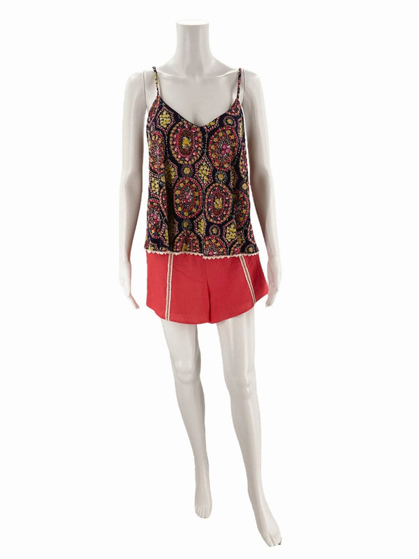 Judith March Romper - Floral Navy Coral Yellow displayed on mannequin, featuring sleeveless top and coral shorts with zipper detail.