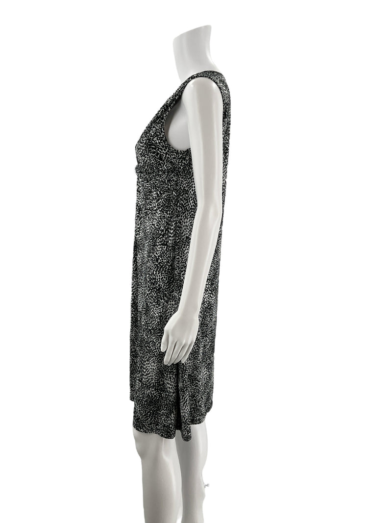 Side profile of Peck & Peck sleeveless A-line dress in black and white animal print, medium size, with soft stretch jersey fabric.