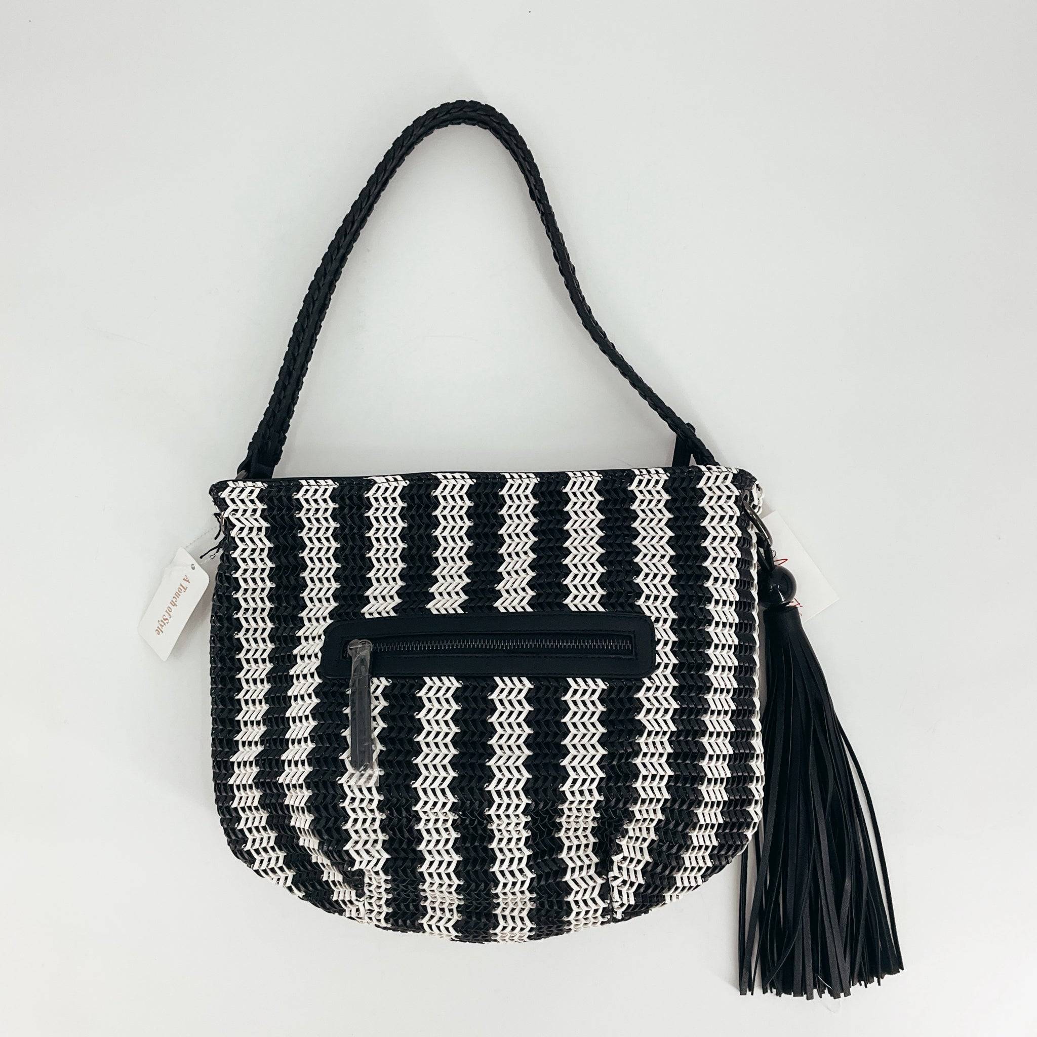 A Touch Of Style Black/White Woven NWT Purse with striped pattern and front zipper, available at Margaret's. Features braided strap and tassel detail.