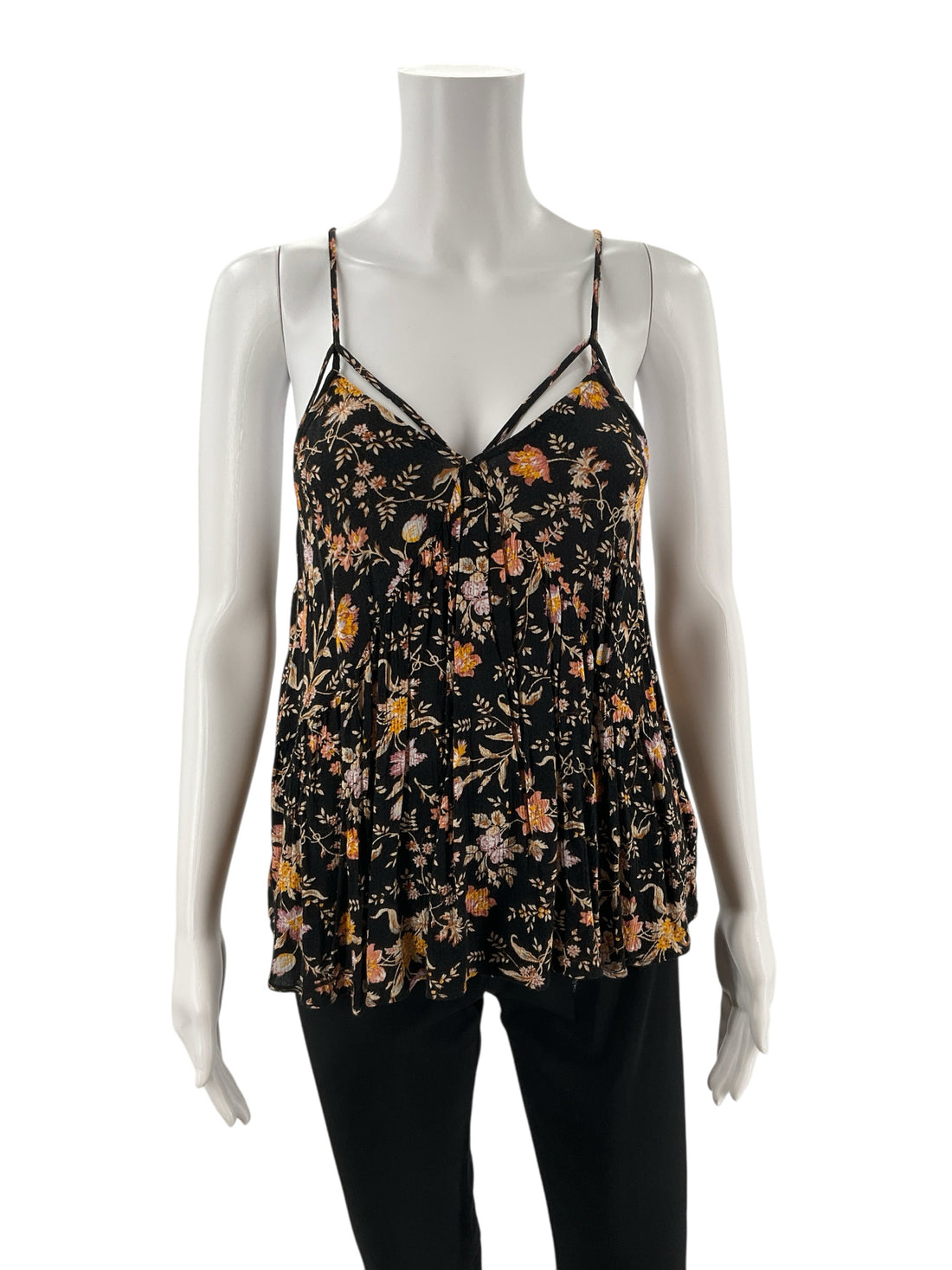 Front view of pre-owned American Eagle black and mustard floral tank top with a flowy silhouette and V-neckline on mannequin.