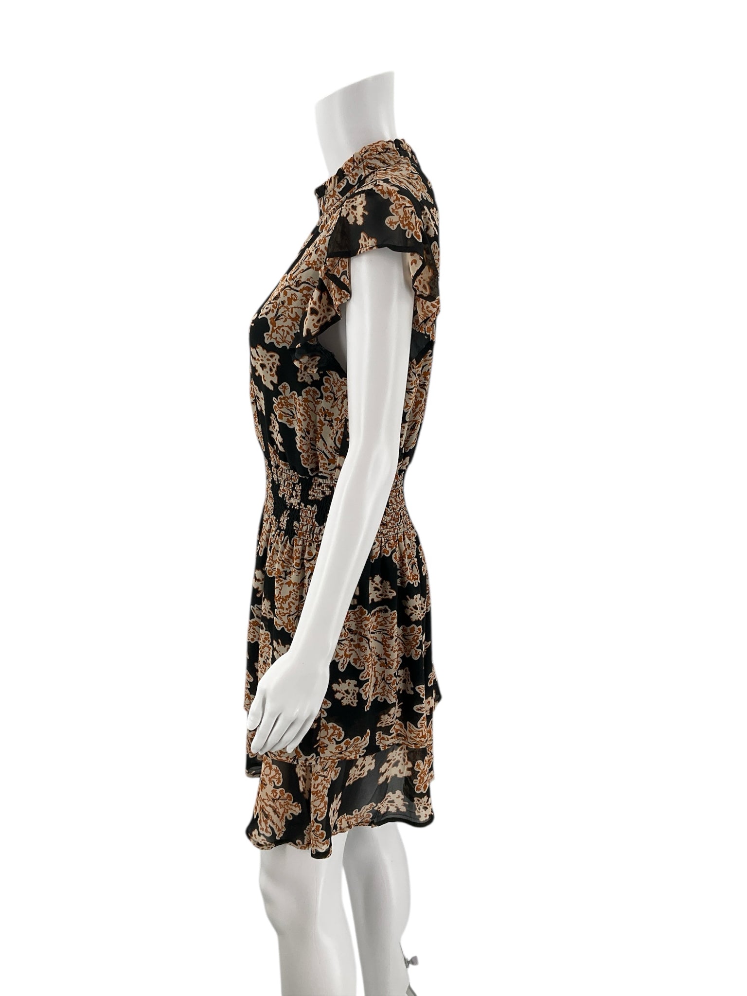 Side profile of THML Black/Camel Flora Dress - Size Small with flowy hem and camel floral pattern on black fabric, gently used and stylish.
