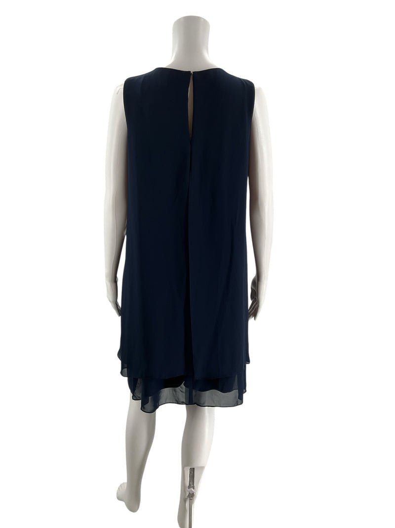 Back view of SLNY navy blue shift dress, size 10, featuring a keyhole closure and layered chiffon hem for formal wear.