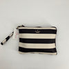Kate Spade Black/White Stripe Clutch with wristlet strap, gently used and available at Margaret’s Fine Consignments. Bold striped design adds chic flair.