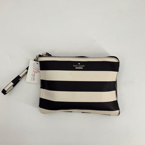 Kate Spade Black/White Stripe Clutch with wristlet strap, gently used and available at Margaret’s Fine Consignments. Bold striped design adds chic flair.