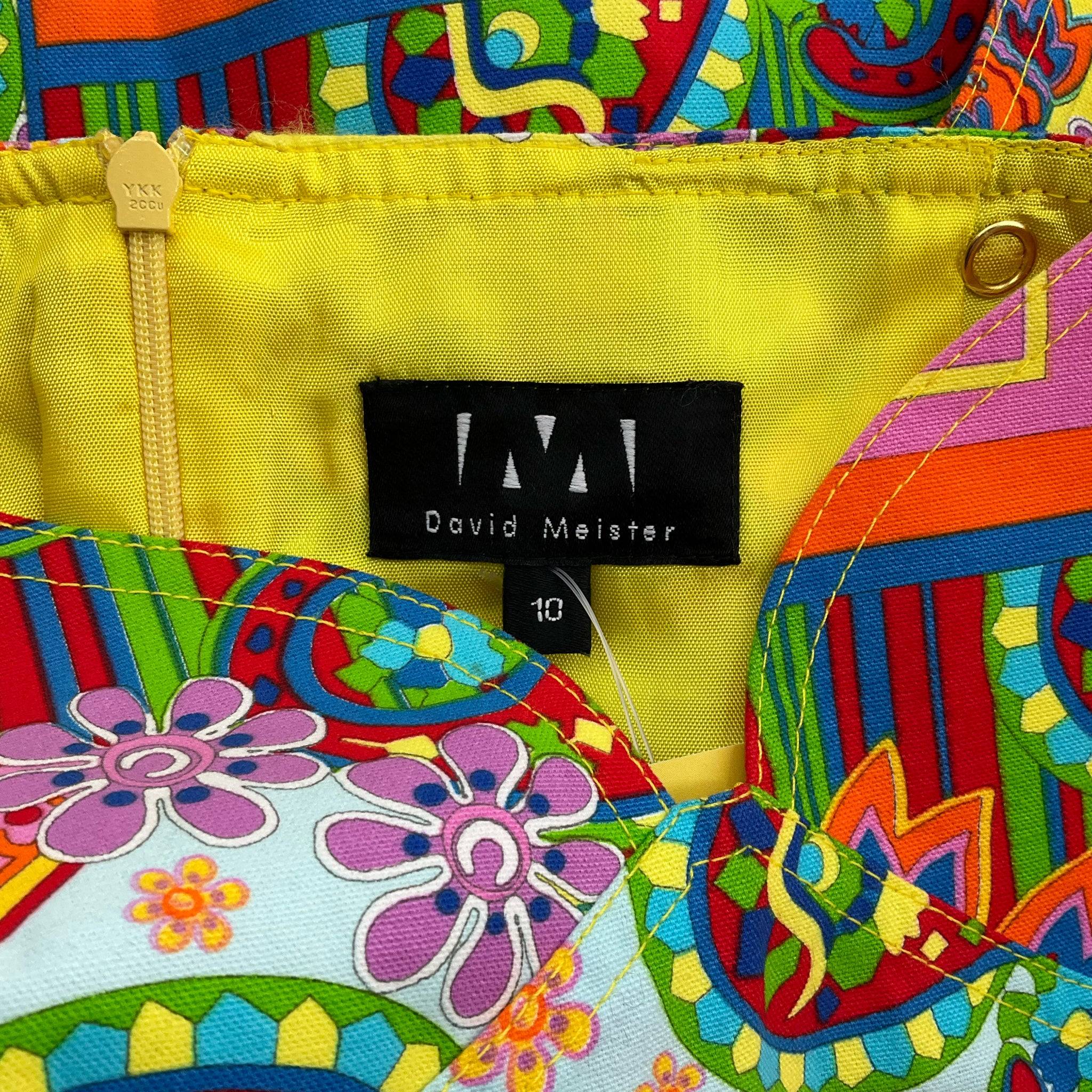 Close-up of David Meister brand label and size tag on sleeveless rainbow print dress size 10, available at Margaret’s Fine Consignments.
