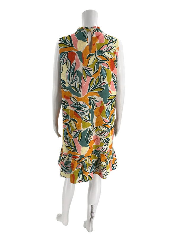 Back view of THML sleeveless dress, size large, featuring vibrant leaf print in teal, yellow, pink, and orange with ruffled hem detail.