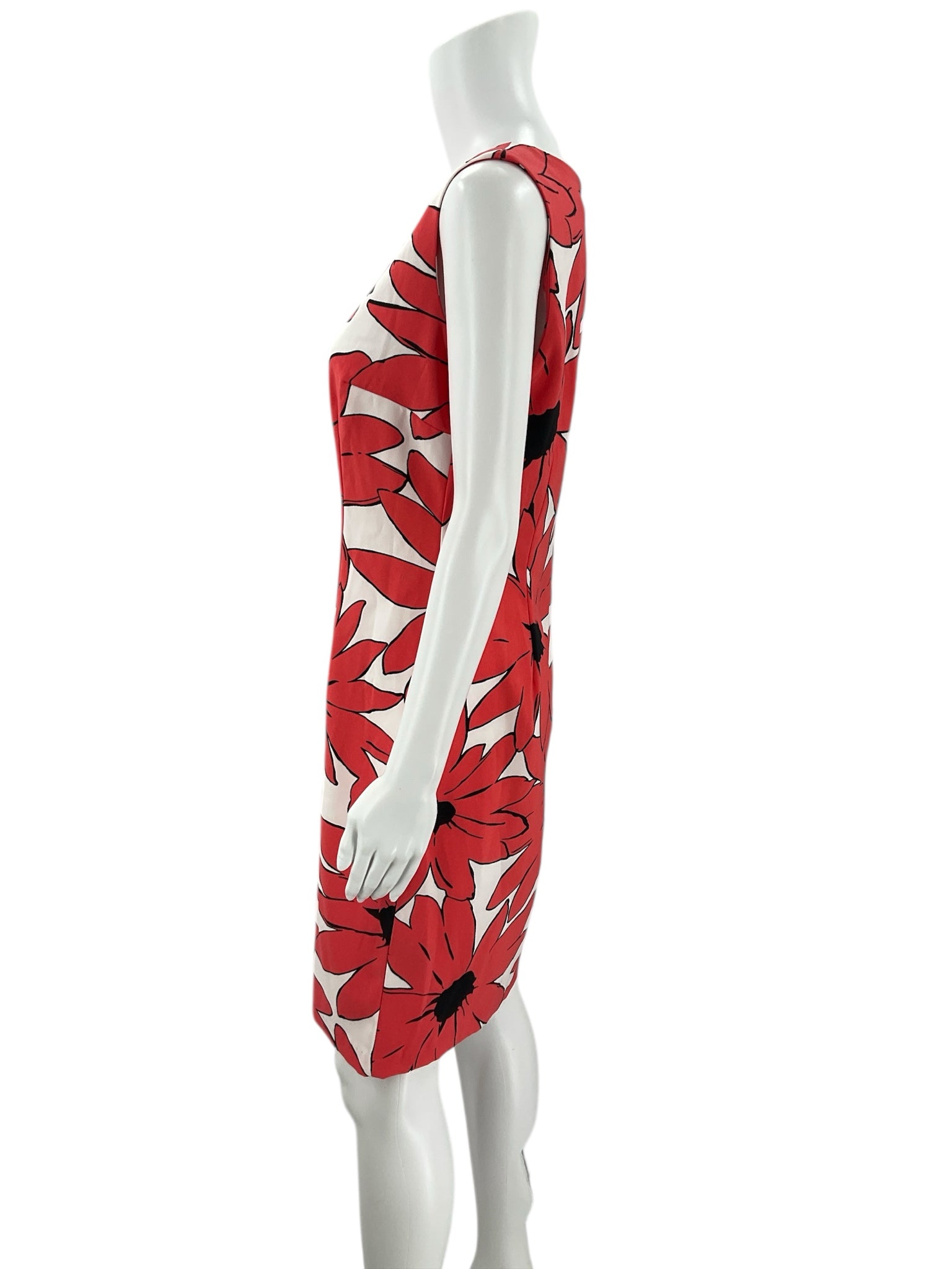 Side profile of Ronni Nicole White/Coral Floral Dress - Size 8 highlighting the fitted silhouette and sleeveless cut for warm-weather wear.