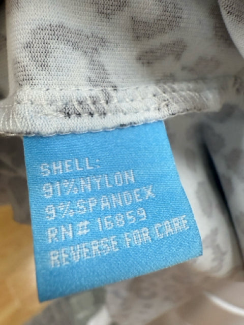 Fabric content tag of J. McLaughlin Blue Animal Print Dress, showing 91% nylon and 9% spandex composition with RN# 16853.