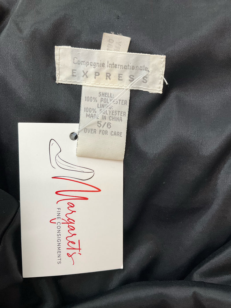Close-up of Express dress label showing Compagnie Internationale Express branding and size 5/6, confirming vintage authenticity.