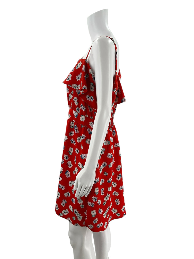Side profile of Xhiliration Orange/Multi Floral Pre-Owned Ladies Dress - Size Large. Highlights ruffle detail and floral pattern on red fabric.