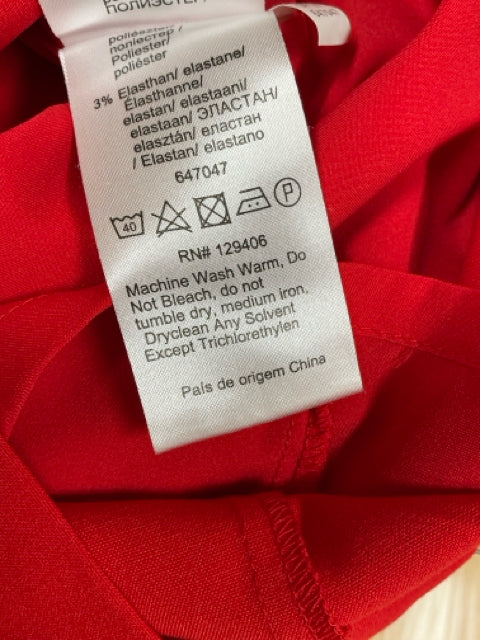 Care label of Venus Red Solid Pre-Owned Ladies Dress - Size 10, indicating washing instructions and RN number 129406.