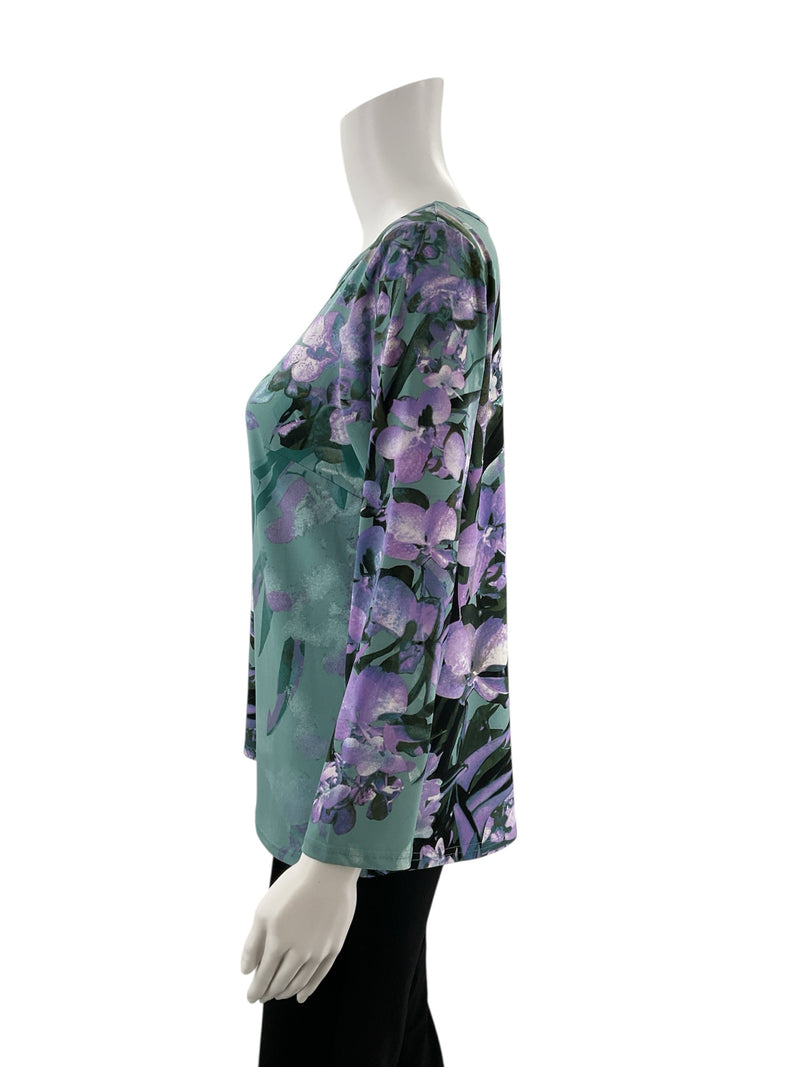 Side profile of Bob Mackie Green/Purple Floral Pre-Owned Ladies Top - Size XS, highlighting 3/4 sleeves and relaxed tunic fit.
