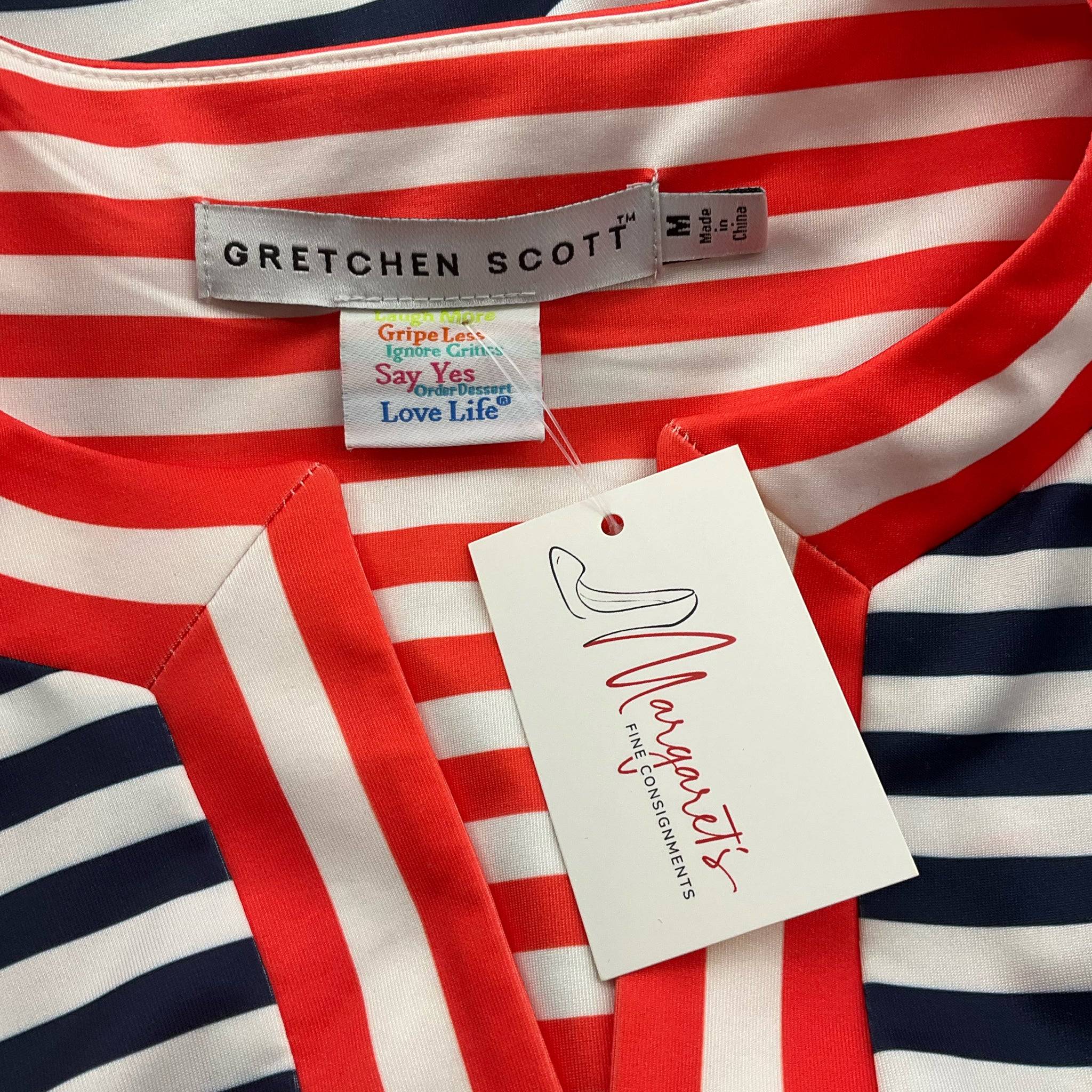 Close-up of Gretchen Scott dress label and tag, confirming size medium and brand authenticity for pre-owned resale.