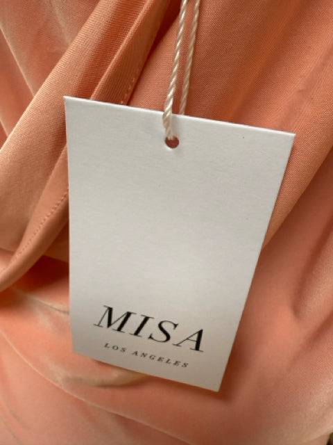 Close-up of MISA Los Angeles brand tag attached to the peach Mini Dress Size Medium, sold at Margaret’s Fine Consignments.