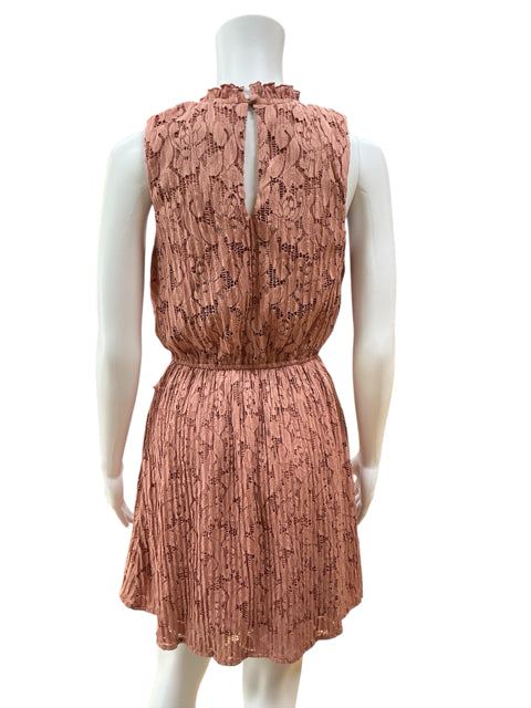 Back view of C. Wonder mauve lace dress showing keyhole closure and elastic waist, ideal for feminine and romantic occasions.
