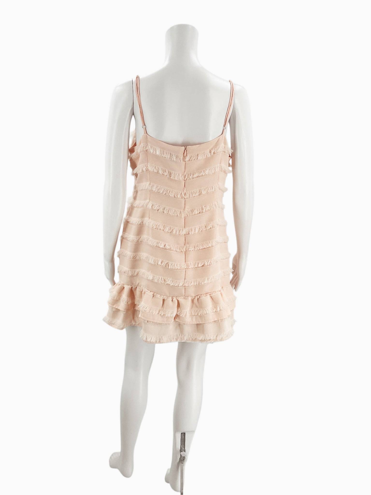 Back view of Princess Polly blush fringe mini dress size 12 with spaghetti straps, sold by Margaret’s Fine Consignments.