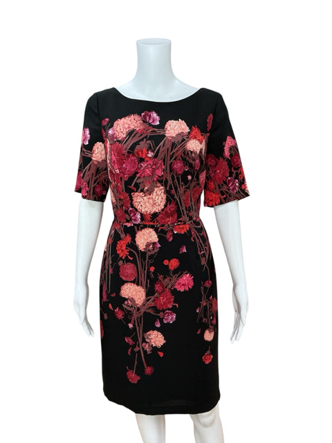 Front view of Adrianna Papell Black/Pink Floral Pre-Owned Ladies Dress - Size 8 on mannequin, featuring fitted sheath silhouette and pink floral design.