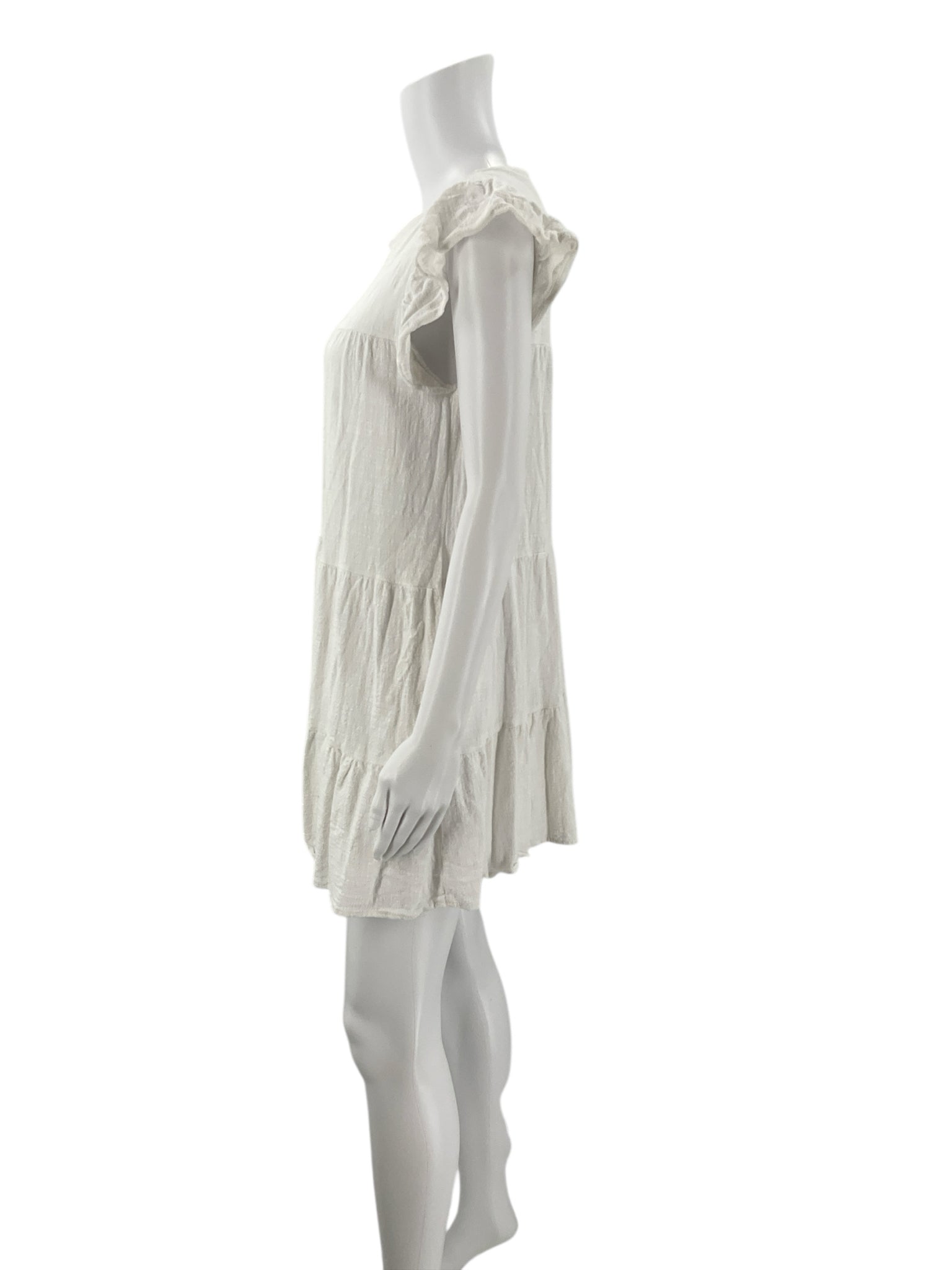Side profile of Altar'd State White Solid Dress - Size XS showing lightweight fabric and relaxed fit, perfect for warm weather occasions.