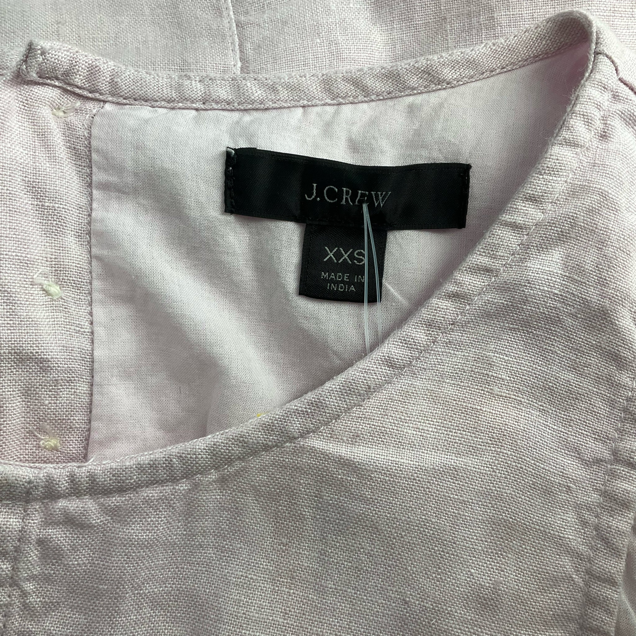 Close-up of J Crew label on Lavender Solid Dress - Size XXS, confirming brand and size for authenticity.