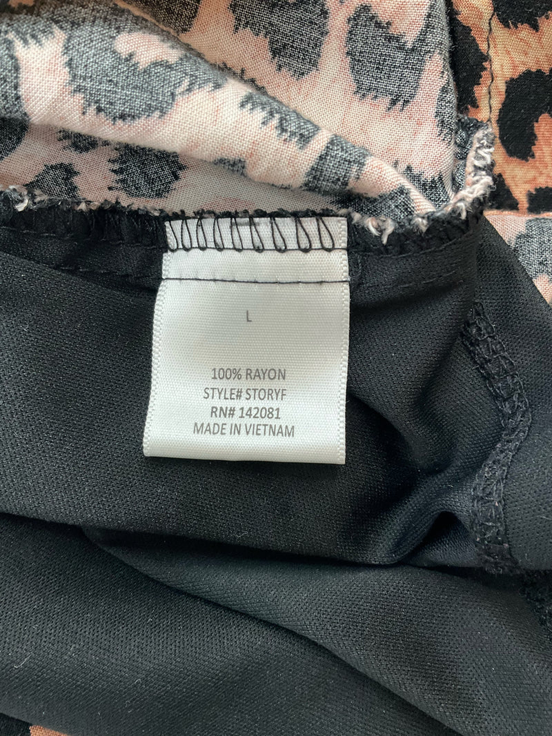 Fabric tag of Blue Rain Brown/Black Print Dress indicating 100% rayon material, style STORYF, and RN# 142081.