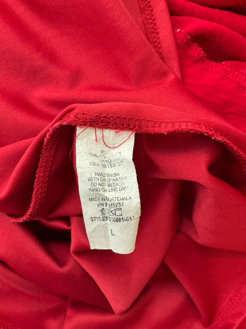 Fabric care and size label of Altar'd State red dress, showing size large, style D00861-05, and washing instructions for rayon blend material.