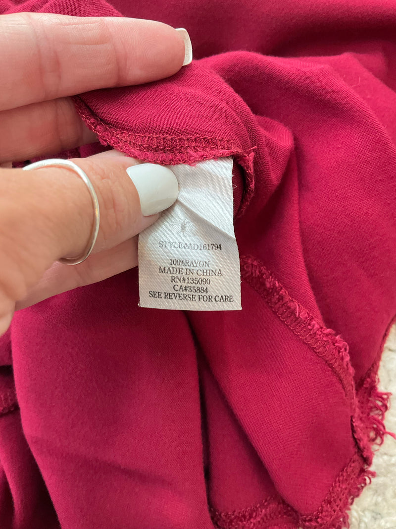 Fabric tag of Altar'd State burgundy dress indicating 100% rayon material, style AD161794, and made in China, size large.