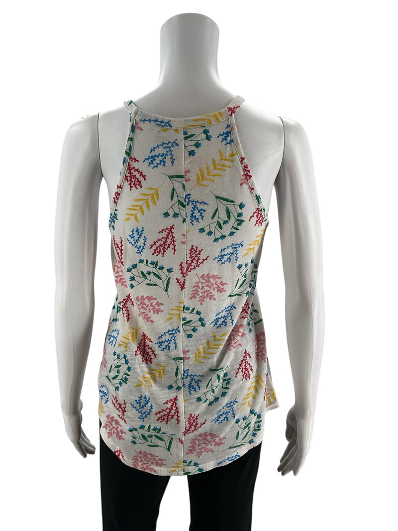 Back view of Gap White/Multi Floral Pre-Owned Ladies Top - Size XS on mannequin, highlighting racerback design and soft cotton-modal fabric.