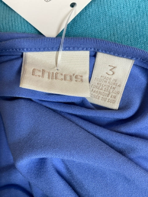 Chico’s size tag showing size 3, equivalent to XL, on a blue solid pre-owned ladies top made in South Korea, confirming brand and sizing.